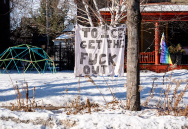 Large sign in a Minneapolis front yard with a quote from Mayor  Jacob Frey: "TO ICE: GET THE FUCK OUT" seen on January 12, 2025.