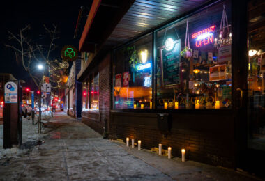 Candles at Morrissey's Irish Pub on Lake Street in Uptown Minneapolis in memory of Alex Pretti who was shot and killed by Border Patrol officers earlier in the day.