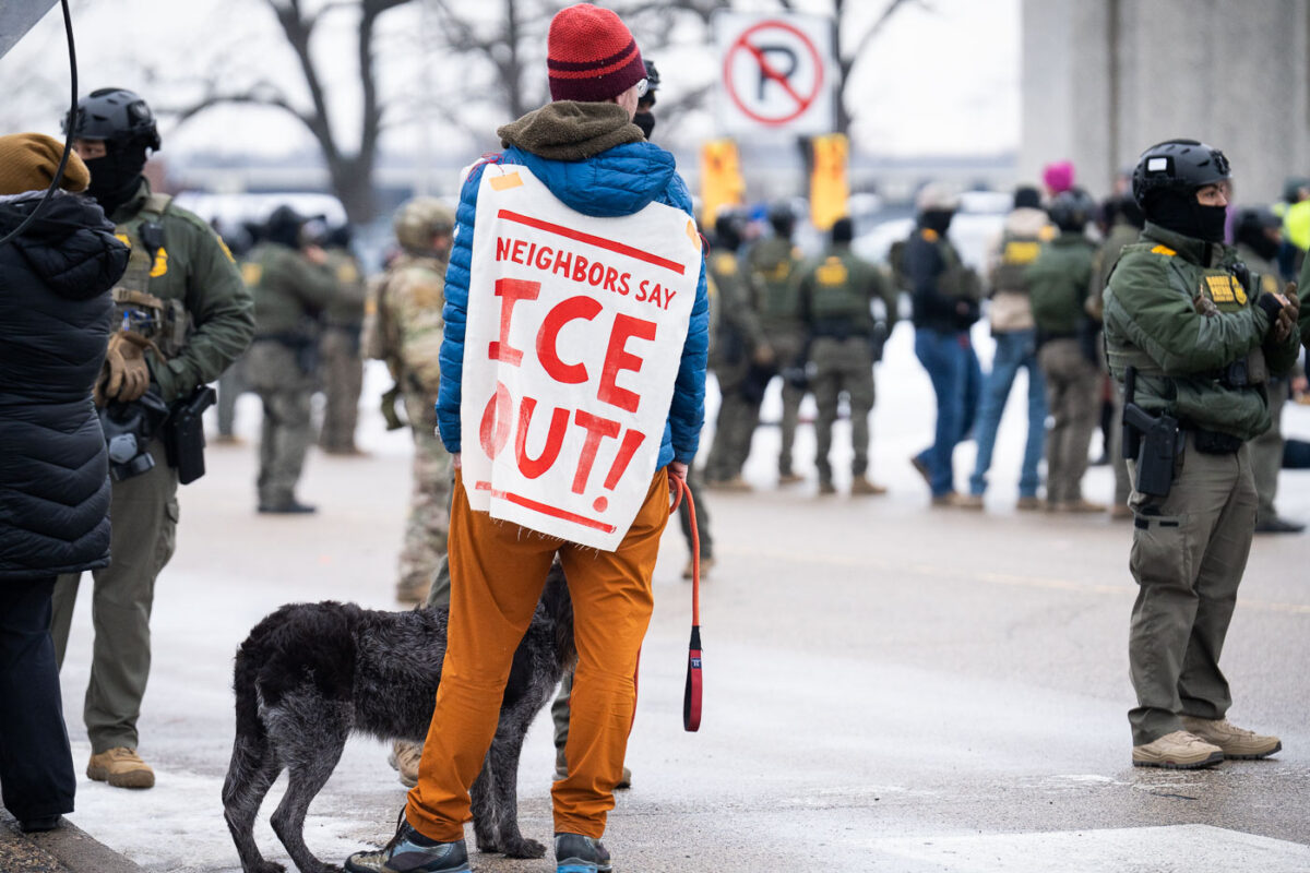 A protester with his dog at the Whipple federal building.