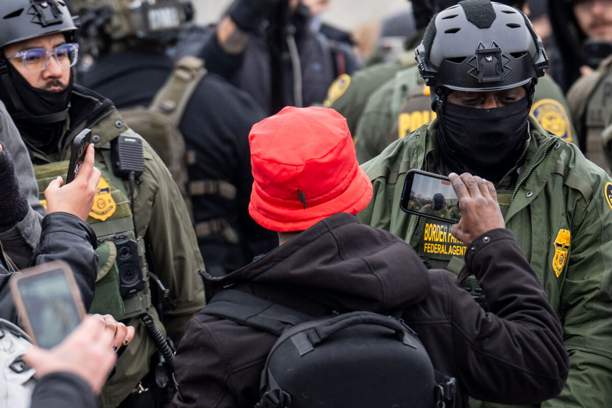 Protester records Border Patrol agent