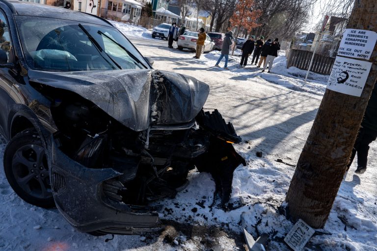 Damaged ICE Vehicle at 32nd and 15th, Minneapolis 1 Damaged ICE vehicle at 32nd and 15th Streets in Minneapolis, with anti-ICE signs on a nearby tree.