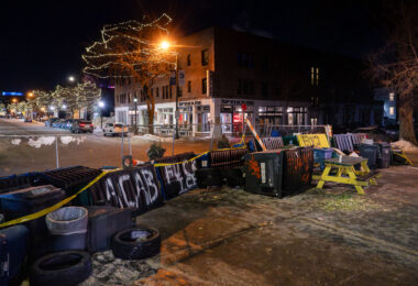 Street barricades on Nicollet Ave on the streets around a memorial for Alex Pretti. The memorial is located on Nicollet Avenue where he was shot and killed by ICE agents earlier in the day.