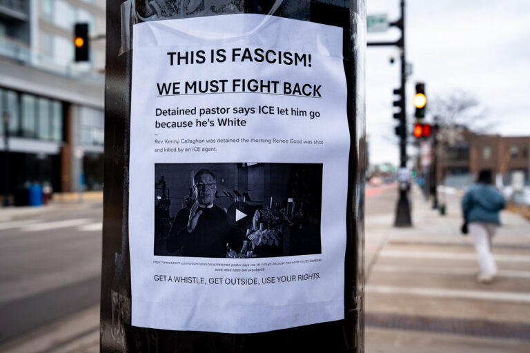 This is Fascism, We Must Fight Back, Minneapolis 4 Protest sign on a pole at Lake Street and Girard Avenue in Uptown Minneapolis on January 13, 2026. The signs read:THIS IS FASCISM!WE MUST FIGHT BACKDetained pastor says ICE let him go because he’s WhiteRev. Kenny Callaghan was detained the morning Renee Good was shot and killed by an ICE agent.GET A WHISTLE, GET OUTSIDE, USE YOUR RIGHTS.