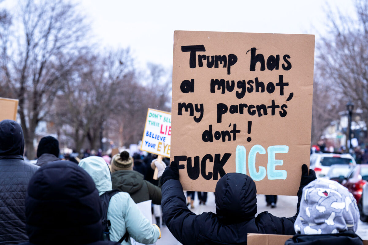 Trump Mugshot Protest Sign in Minneapolis