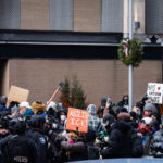 Trump Rapes Kids protest sign in Minneapolis 2 Protesters at a counter Jake Lang protest in Minneapolis holding up signs that read:TRUMP RAPES KIDSABOLISH ICE