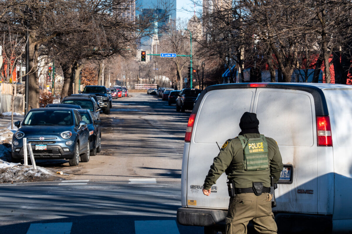 US Border Patrol Officer watches van pull away