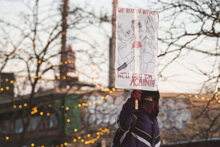 Protest sign at scene of Alex Pretti killing, Minneapolis 2 WE BEAT EM BEFORE WE'LL BEAT EM AGAIN!!!