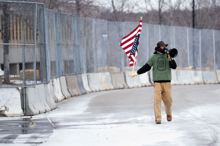William Kelly Dawokefarmer at Whipple Building, Minneapolis 1 William Kelly protesting at the Whipple Building near Minneapolis. The building is being used as an ICE detention center and a base of operations for thousands of federal agents.
