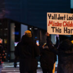 Ya'll don't look for rmissing children this hard, Minneapolis 3 Woman on Lake Street in Uptown Minneapolis holding up a sign that reads: "Ya'll don't look for missing children this hard" on January 19, 2026.