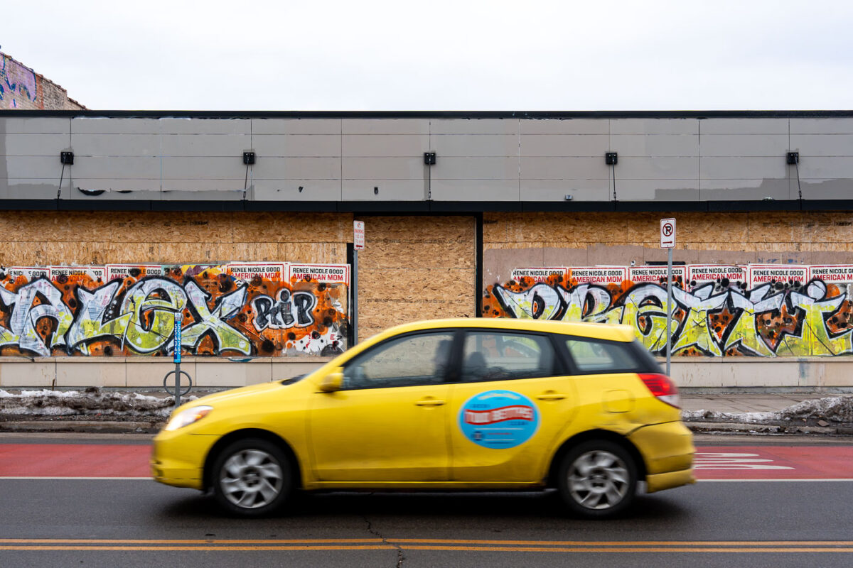 Graffiti on a boarded up building on Lake Street in Minneapolis reading ALEX PRETTI. Pretti was shot and killed last month by federal agents in Minneapolis.