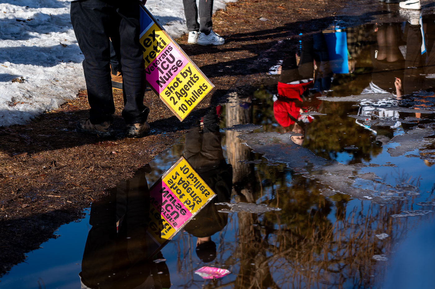 Alex Pretti Protest signs reflected in Minneapolis
