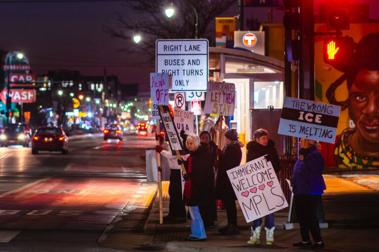Anti ICE Protesters at Lake and Chicago in Minneapolis 3 Anti-ICE protesters on Lake Street at Chicago Avenue holding signs that read:"THE WRONG ICE IS MELTING""HANDS OFF SOCIAL SECURITY""ICE OUT OF USA""IMMIGRANTS LET THEM STAY"Protesters continue to occur around the city following thousands of federal agents being deployed to Minnesota as part of "Operation Metro Surge".