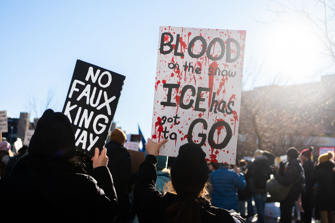 Blood on the snow protest sign Minneapolis
