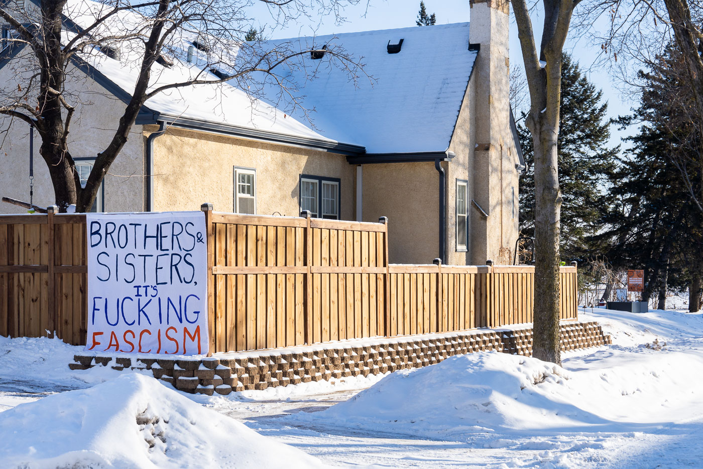 BROTHERS & SISTERS IT'S FUCKING FASCISM sign