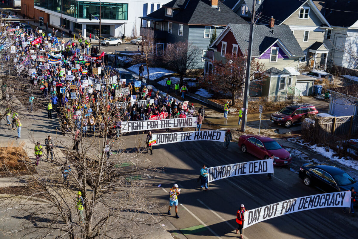 Today in Minneapolis, those demanding justice for everyone shot and/or killed by federal agents over the last 2 months, protesters marched from Stewart Park to the memorial of Alex Pretti.
Pretti was shot and killed by border patrol agents while he was unarmed on January 24, 2026. Video shows agents removing a gun from Pretti prior to shots being fired.
The “Day Out For Democracy” rally and march was organized by Minnesota AFL-CIO.