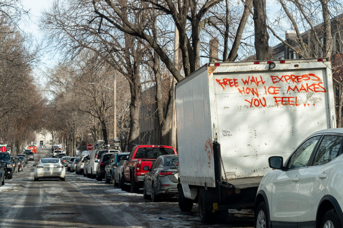 A box truck with "Free wall express how ice makes you feel...." written on the back. Seen in South Minneapolis.