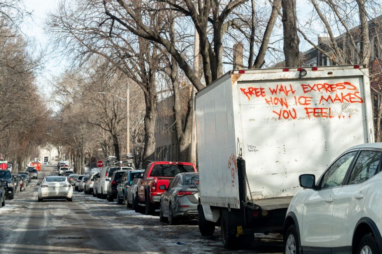 "How ICE Makes You Feel" Graffiti on a South Minneapolis Box Truck 1 Box truck with red graffiti reading "Free Wall Express How Ice Makes You Feel" parked on Minneapolis street.