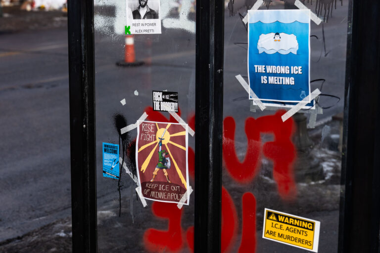 Keep ICE Out of Minneapolis 2 Protest signs on the side of a bus stop near the Alex Pretti Memorial on Nicollet Avenue in Minneapolis."I.C.E. AGENTS ARE MURDERERS""RISE and FIGHT KEEP ICE OUT OF MINNEAPOLIS""THE WRONG ICE IS MELTING""REST IN POWER ALEX PRETTI""IMMIGRANTS WELCOME"