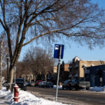 Nicollet Ave in Minneapolis Protect Sign 3 A "Protect" sign showing a cartoon woman with a whistle. Whistles are used to warn those in the area that ICE is nearby.