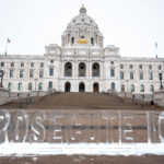 Prosecute ICE Sculpture at the Minnesota State Capitol 1 This morning at the Minnesota State Capitol in St. Paul.An ice sculpture that reads "PROSECUTE ICE". I'm told the organization behind the sculpture is Common Defense.