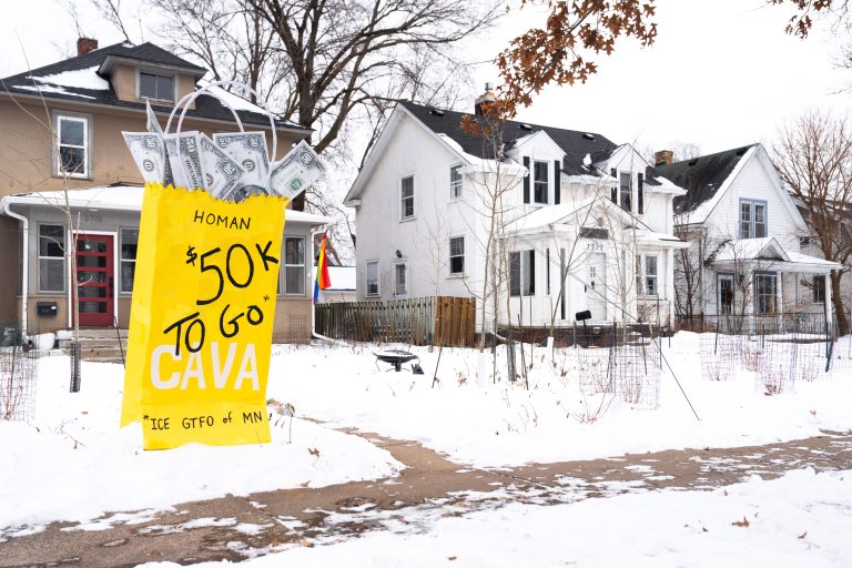Minneapolis Protest Sign: $50K to Go CAVA, ICE GTFO of MN 4 A protest sign in Minneapolis, Minnesota, reads "HOMAN $50K TO GO CAVA" and "ICE GTFO of MN."