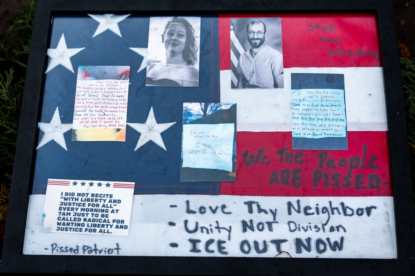 A memorial display for Alex Pretti features a framed American flag with photos and handwritten text, including "We The People ARE PISSED."