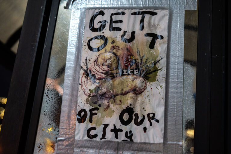 ICE Get Out Of Our City Flyer 2 Anti ICE flyer on a Minneapolis storefront