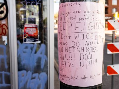 Kids leaves protest sign at Alex Pretti Memorial