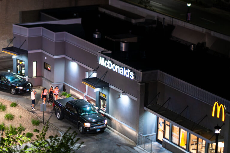 Pedestrians and cars at Uptown Minneapolis McDonalds 3 Walkers in the drive thru line at McDonalds in Minneapolis
