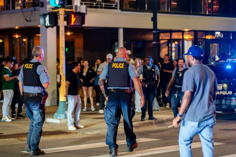 Minneapolis Police officers outside Lake Street night club 2 Minneapolis police officers outside Rumba nightclub