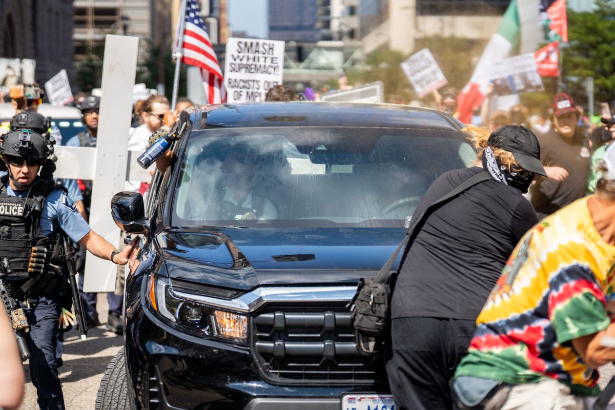 Counter-protester confronts Jake Lang’s SUV, Minneapolis City Hall