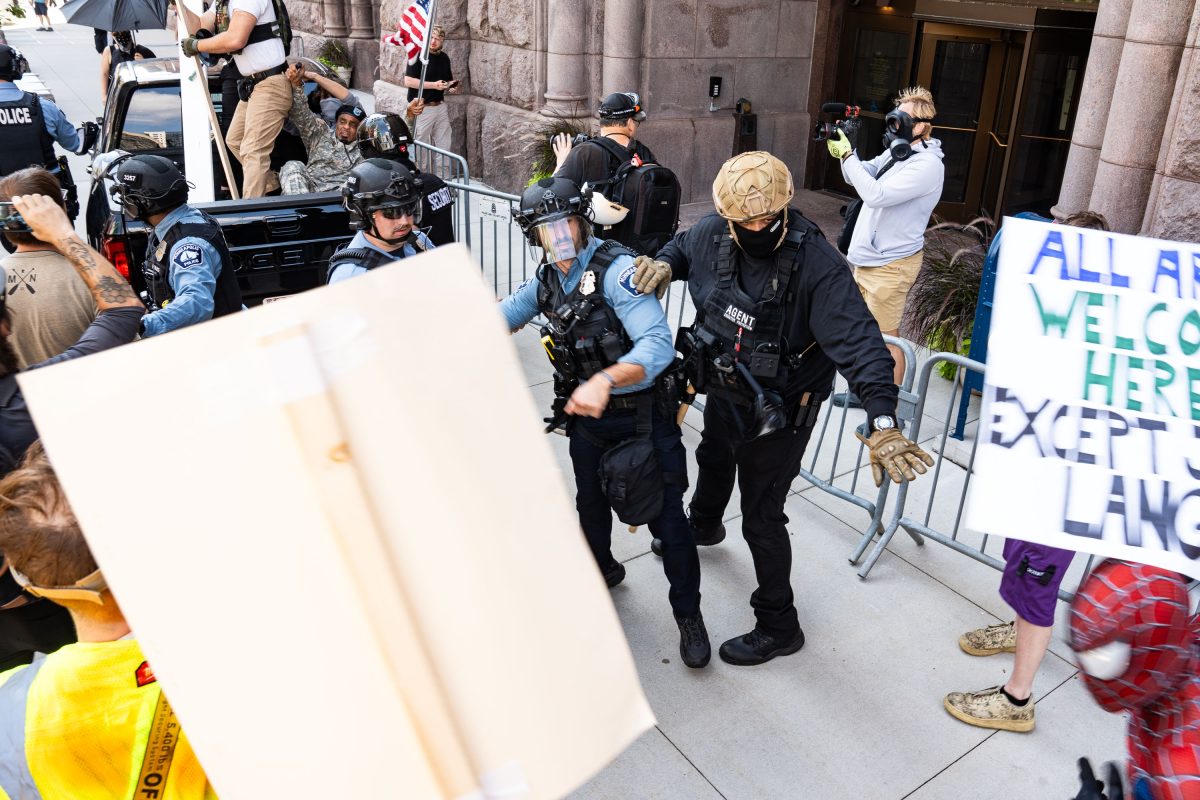 Security Agents Detain Protester at Jake Lang Rally, Minneapolis City Hall