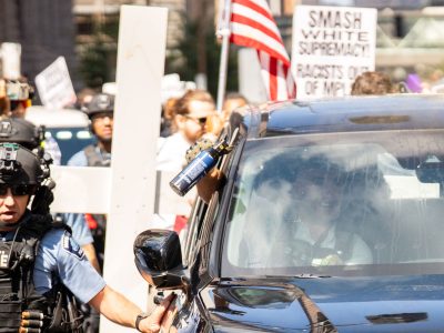 "Smash White Supremacy" sign near Jake Lang's SUV, Minneapolis City Hall