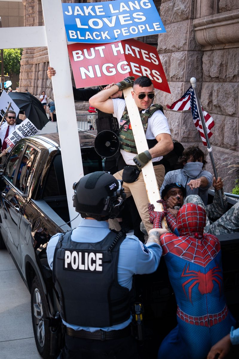 Spider Man Attempts to Take Jake Lang’s Racist Sign in Minneapolis