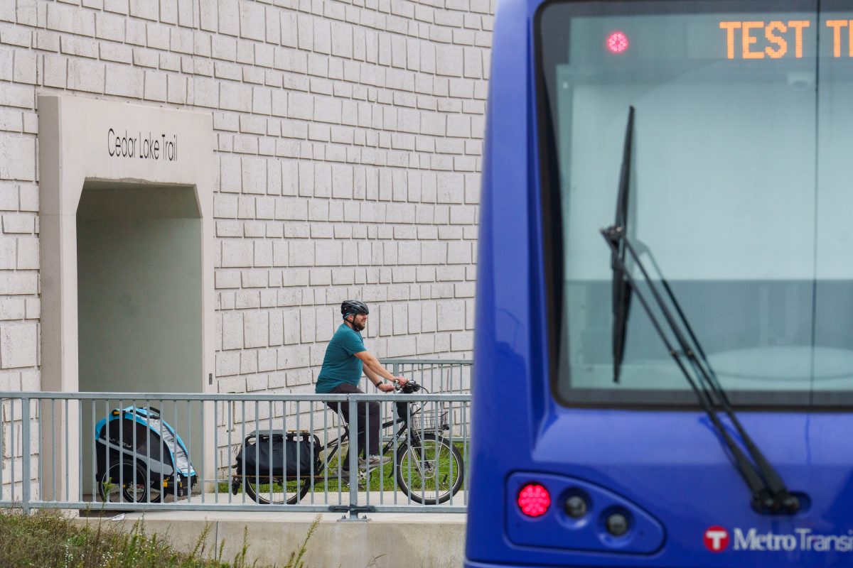 Biker goes through Cedar Lake Trail Tunnel, Louisiana Station
