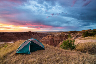 Sunrise over our tent at the Buffalo Gap National Grasslands. This Bureau of Land Management spot is one of our absolute favorite camping spots. Sunrise over our tent at the Buffalo Gap National Grasslands. This Bureau of Land Management spot is one of our absolute favorite camping spots.
