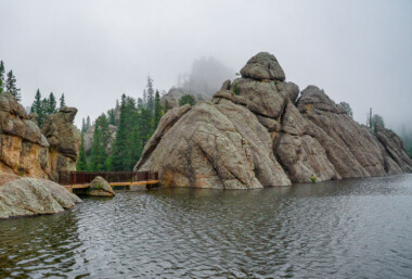 Sylvan Lake is a lake located in Custer State Park, in the Black Hills of South Dakota, United States. It was created in 1881 when Theodore Reder built a dam (the Sylvan Lake Water Dam) across Sunday Gulch Creek. The lake area offers picnic places, rock climbing, small rental boats, swimming, and hiking trails. It is also popular as a starting point for excursions to Black Elk Peak and The Needles.  -- Wikipedia Sylvan Lake is a lake located in Custer State Park, in the Black Hills of South Dakota, United States. It was created in 1881 when Theodore Reder built a dam (the Sylvan Lake Water Dam) across Sunday Gulch Creek. The lake area offers picnic places, rock climbing, small rental boats, swimming, and hiking trails. It is also popular as a starting point for excursions to Black Elk Peak and The Needles.  -- Wikipedia