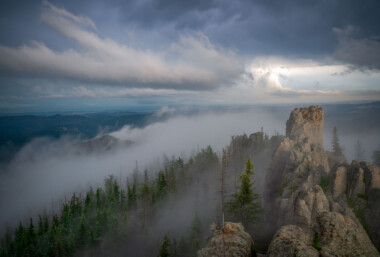 Black Elk Peak (formerly Harney Peak) is the highest natural point in South Dakota, United States. It lies in the Black Elk Wilderness area, in southern Pennington County, in the Black Hills National Forest. The peak lies 3.7 mi (6.0 km) west-southwest of Mount Rushmore. At 7,242 feet (2,207 m), it has been described by the Board on Geographical Names as the highest summit in the United States east of the Rocky Mountains. Though part of the North American Cordillera, it is generally considered to be geologically separate from the Rocky Mountains. Lost Mine peak in the Chisos mountains of Texas, at an elevation of 7,535 feet, is the furthest east peak within the continental United States above 7,000 feet. Source: Wikipedia Black Elk Peak (formerly Harney Peak) is the highest natural point in South Dakota, United States. It lies in the Black Elk Wilderness area, in southern Pennington County, in the Black Hills National Forest. The peak lies 3.7 mi (6.0 km) west-southwest of Mount Rushmore. At 7,242 feet (2,207 m), it has been described by the Board on Geographical Names as the highest summit in the United States east of the Rocky Mountains. Though part of the North American Cordillera, it is generally considered to be geologically separate from the Rocky Mountains. Lost Mine peak in the Chisos mountains of Texas, at an elevation of 7,535 feet, is the furthest east peak within the continental United States above 7,000 feet. Source: Wikipedia