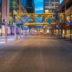 Nicollet Mall in Downtown Minneapolis during the coronavirus (COVID-19) outbreak. Normally busy with pedestrians and buses, only one Metro Transit Bus and bicycle is found in view.