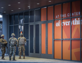 The National Guard patrol Nicollet Mall in Downtown Minneapolis prior to a 10pm curfew during unrest over the killing of George Floyd.