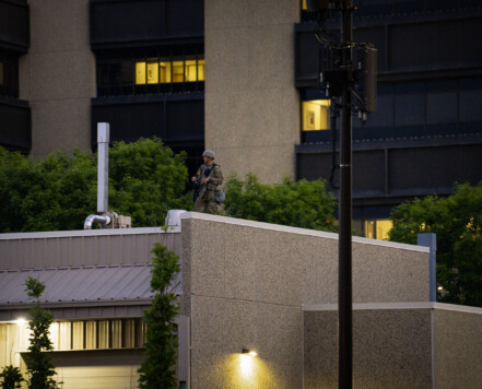 A National Guard member on the roof of the Hennepin County Sheriff’s Forensic Science Laboratory in downtown Minneapolis. About an hour later a 10pm curfew went into effect due to unrest over the killing of George Floyd on May 25th while in custody of the Minneapolis Police. A National Guard member on the roof of the Hennepin County Sheriff’s Forensic Science Laboratory in downtown Minneapolis. About an hour later a 10pm curfew went into effect due to unrest over the killing of George Floyd on May 25th while in custody of the Minneapolis Police.