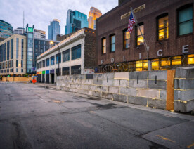 Concrete blocks and razor wire placed around the Minneapolis police 1st precinct police station in Downtown Minneapolis. The precinct was secured after the 3rd precinct police station was burned about 10 days prior after the death of George Floyd.