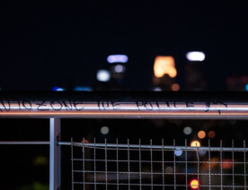 The Martin Olav Sabo bridge over Haiwatha Ave with "Autozone the police" written on it. AutoZone was the first building burned following the May 25th, 2020 death of George Floyd.