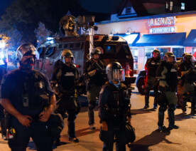 Minneapolis Police along with State Patrol Conservation Officers arrive to the 5th Precinct with a large amount of tactical gear to clear out and arrest 51 people protesting after Derek Chauvin is released on bail.