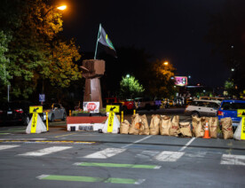 Lawn clipping bags used as barricades after the city cleared out barricades at 39th/Chicago Ave.