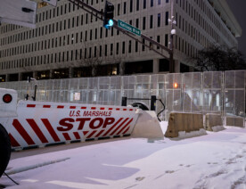 Security around the Warren E. Burger Federal Building in downtown St. Paul the night before opening statements in the federal trial of the officers accused of violating George Floyd's civil rights.