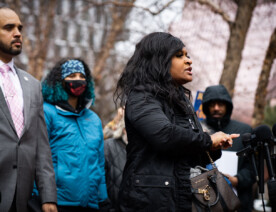 Activists speak outside the courthouse following the announcement of no charges against officers involved in the February 2nd shooting death of Amir Locke.