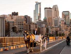 A horse drawn carriage on the Stone Arch Bridge near downtown Minneapolis.