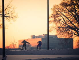 Snowboarders in Minneapolis after a large snowfall.