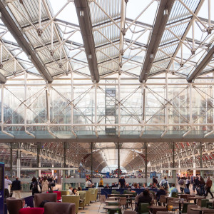 Paddington, also known as London Paddington, is a Central London railway terminus and London Underground station complex, located on Praed Street in the Paddington area. The site has been the London terminus of services provided by the Great Western Railway and its successors since 1838. Much of the main line station dates from 1854 and was designed by Isambard Kingdom Brunel.Paddington is the London terminus of the Great Western main line, operated today by Great Western Railway, which provides the majority of commuter and regional passenger services to west London and the Thames Valley region as well as long-distance intercity services to South West England and South Wales. It is also the terminus for the Heathrow Express and TfL Rail services to and from Heathrow Airport. It is one of 11 London stations managed directly by Network Rail. It is situated in fare zone 1 and has two separate tube stations providing connections to the Bakerloo, Circle, District, and Hammersmith & City lines.The station has been perennially popular for passengers and goods, particularly milk and parcels. Major upgrades took place in the 1870s, the 1910s and the 1960s, each trying to add additional platforms and space while trying to preserve the existing services and architecture as much as possible. Paddington was first served by London Underground trains in 1863, as the original western terminus of the Metropolitan Railway, the world's first underground railway. In the 20th century, suburban and commuter services appeared at Paddington as the urban sprawl of London moved westwards. Despite the numerous upgrades and rebuilding, plus damage sustained in particular during World War II, Brunel's original design is still recognisable.Source: <a href="https://en.wikipedia.org/wiki/London_Paddington_station" rel="noreferrer nofollow">en.wikipedia.org/wiki/London_Paddington_station</a> Paddington, also known as London Paddington, is a Central London railway terminus and London Underground station complex, located on Praed Street in the Paddington area. The site has been the London terminus of services provided by the Great Western Railway and its successors since 1838. Much of the main line station dates from 1854 and was designed by Isambard Kingdom Brunel.Paddington is the London terminus of the Great Western main line, operated today by Great Western Railway, which provides the majority of commuter and regional passenger services to west London and the Thames Valley region as well as long-distance intercity services to South West England and South Wales. It is also the terminus for the Heathrow Express and TfL Rail services to and from Heathrow Airport. It is one of 11 London stations managed directly by Network Rail. It is situated in fare zone 1 and has two separate tube stations providing connections to the Bakerloo, Circle, District, and Hammersmith & City lines.The station has been perennially popular for passengers and goods, particularly milk and parcels. Major upgrades took place in the 1870s, the 1910s and the 1960s, each trying to add additional platforms and space while trying to preserve the existing services and architecture as much as possible. Paddington was first served by London Underground trains in 1863, as the original western terminus of the Metropolitan Railway, the world's first underground railway. In the 20th century, suburban and commuter services appeared at Paddington as the urban sprawl of London moved westwards. Despite the numerous upgrades and rebuilding, plus damage sustained in particular during World War II, Brunel's original design is still recognisable.Source: <a href="https://en.wikipedia.org/wiki/London_Paddington_station" rel="noreferrer nofollow">en.wikipedia.org/wiki/London_Paddington_station</a>